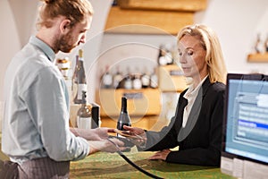 Woman Buying Wine