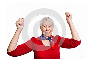 Portrait of a mature woman doing a winner gesture