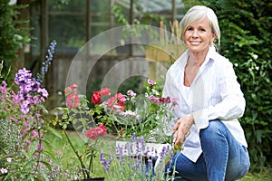 Portrait Of Mature Woman Gardening