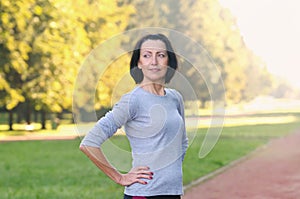 Portrait of mature woman before or after jog in the park