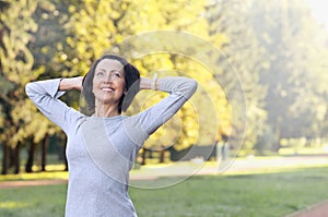 Portrait of mature woman before or after jog in the park