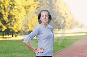 Portrait of mature woman before or after jog in the park photo