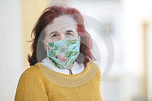 Portrait of mature woman with protective mask