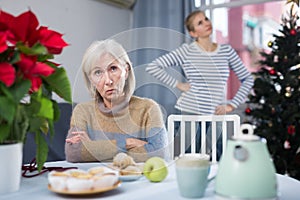 Portrait of a mature woman resentful of her daughter photo