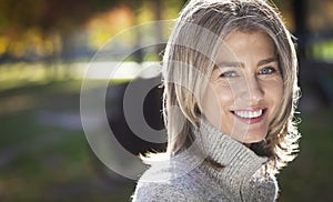 Portrait Of A Mature Woman Smiling At The Camera.Gray hairs.