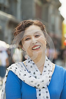 Portrait of mature women smiling outdoors, Beijing