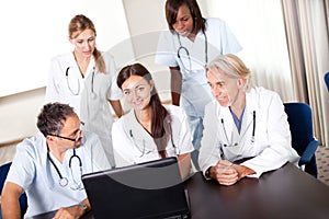 Portrait of mature young doctors working together
