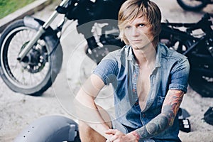 Portrait of a mechanic at work in his garage