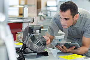 Portrait mechanic working on enginee