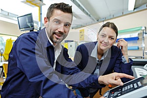 portrait mechanics looking at camera