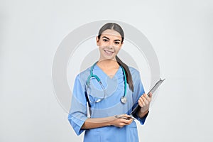 Portrait of medical assistant with stethoscope and clipboard