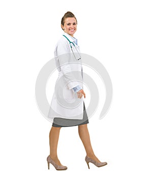 Portrait of medical doctor woman going sideways