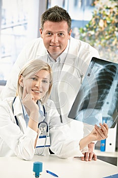 Portrait of medical doctors with x-ray image