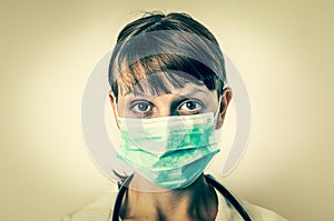Portrait of a medical nurse or doctor in surgeon mask