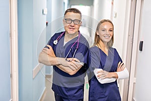 Portrait Of Medical Staff In Corridor Of Modern Hospital