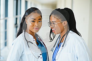 Portrait Of Medical Staff In Corridor Of Modern Hospital