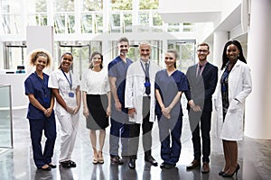 Portrait Of Medical Staff Standing In Lobby Of Hospital