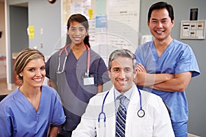 Portrait Of Medical Team At Nurses Station photo