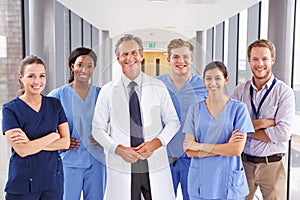 Portrait Of Medical Team Standing In Hospital Corridor