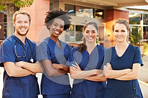 Portrait Of Medical Team Standing Outside Hospital