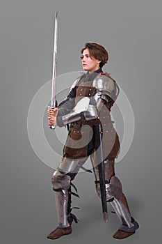 Portrait of a medieval female knight in armour over grey background