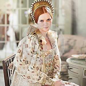 Portrait, medieval and woman smile in a home with queen, renaissance and royalty in a palace room. Luxury, bedroom and