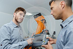 portrait men and robotic machine
