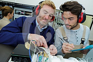 portrait men working with electronics