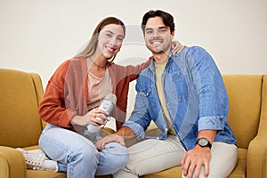 Portrait, microphone and podcast with a couple on a sofa in the living room of their home together. Smile, radio or photo