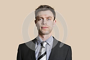 Portrait of a mid adult business professional over colored background