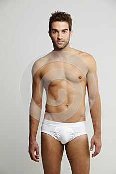 Portrait of mid adult man in briefs