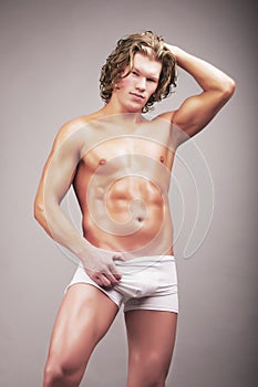 Portrait of mid adult man in briefs