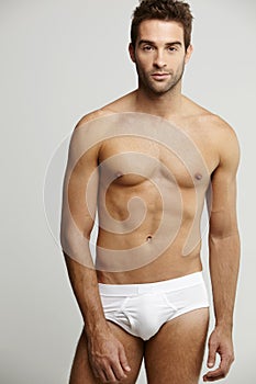 Portrait of mid adult man in briefs