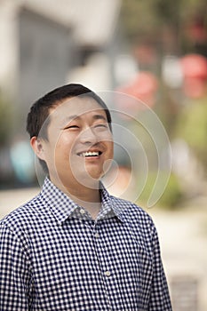 Portrait of Mid Adult Man in Nanluoguxiang, Beijing, China