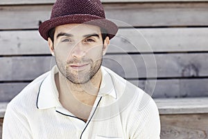 Portrait of mid adult man in red trilby