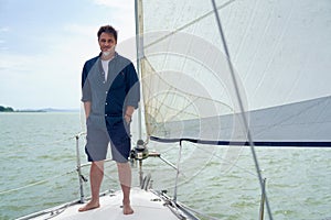 Portrait of mid adult man on sailing boat