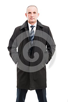 Portrait of middle age business man posing in raincoat