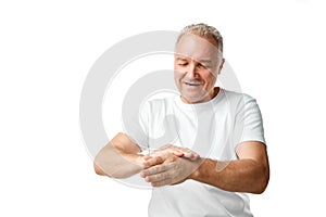 Portrait of middle aged, 45s man using skin care hand cream, lotion against white studio background.