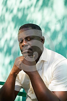 Portrait of middle aged african man staring the camera