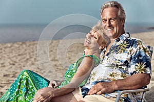 Portrait of middle aged couple on the beach