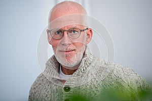 Portrait of middle-aged man with beard and glasses