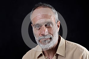 Portrait of a middle aged man on black