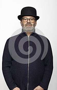 Portrait middle aged man with glasses, bowler hat and round glasses