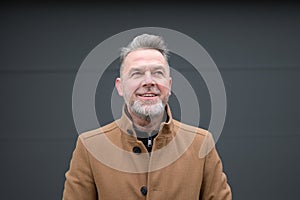 Portrait of a middle-aged man looking friendly up