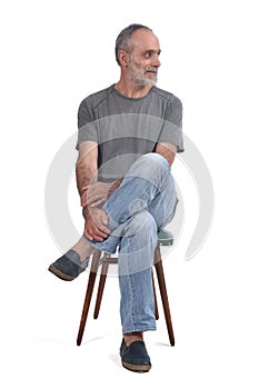 Portrait of middle aged man sitting on white