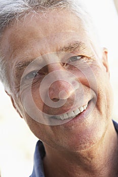 Portrait Of Middle Aged Man Smiling At The Camera