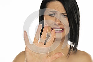 Portrait of middle aged shocked terrified scared speechless woman looking at her nails