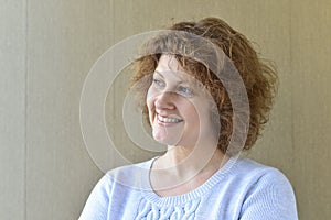 Portrait of middle-aged woman with curly hair