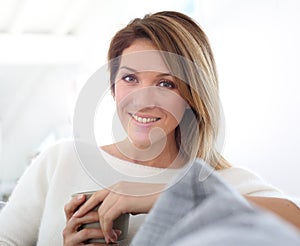 Portrait of middle-aged woman drinking tea