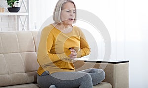 Portrait of middle aged woman having heart attack